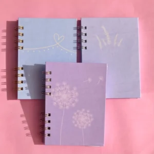 Libreta Trilogía Pastel A6 con encuadernación de discos y diseños pastel