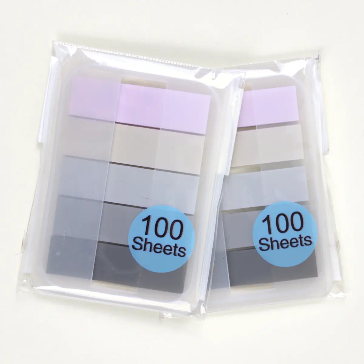 Banderitas flecha pastel y grises dentro de sus cajas dispensadoras