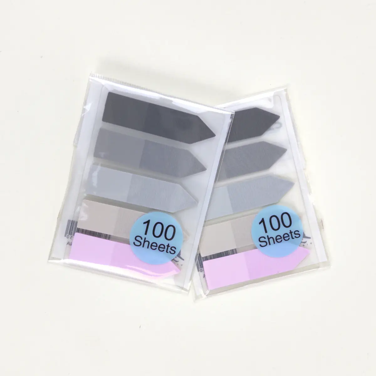 Dos packs de banderitas flecha pastel y grises sin caja dispensadora
