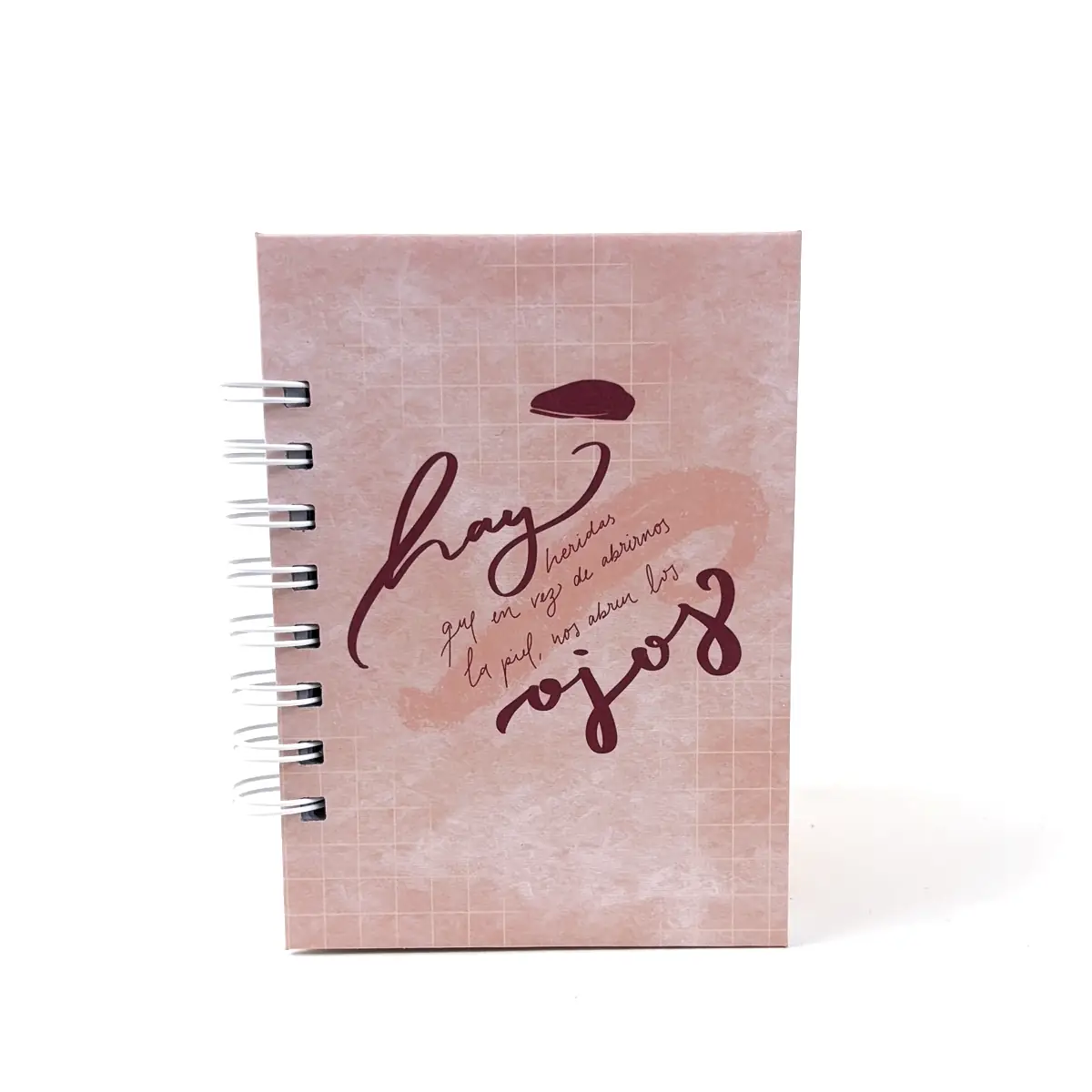 Libreta A6 Clarity rosada con frase manuscrita y anillos laterales