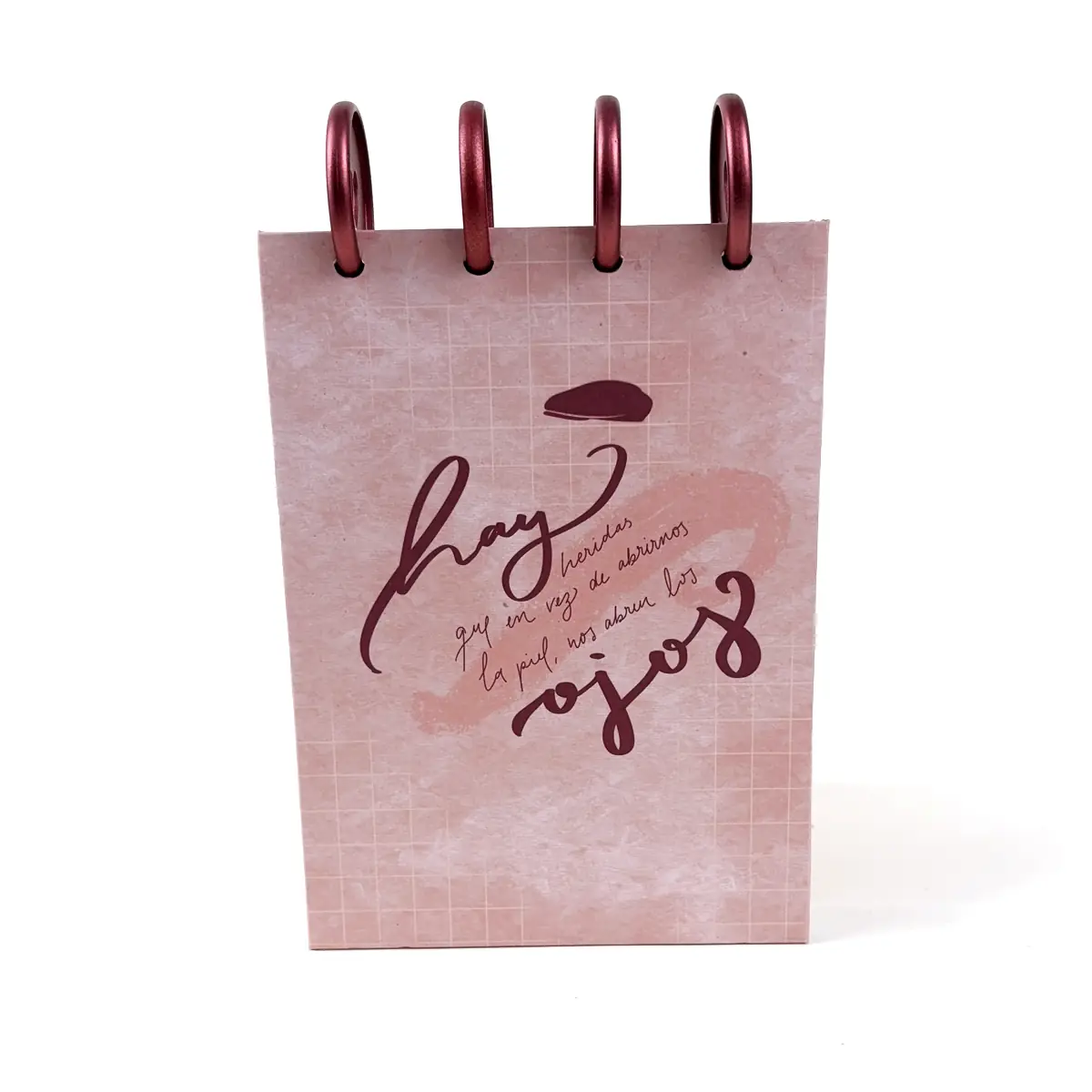 Libreta A6 Clarity rosada con frase manuscrita y discos superiores