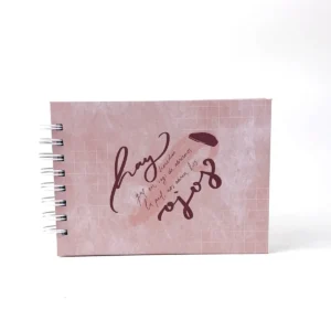 Libreta B6 Clarity horizontal rosada con frase manuscrita